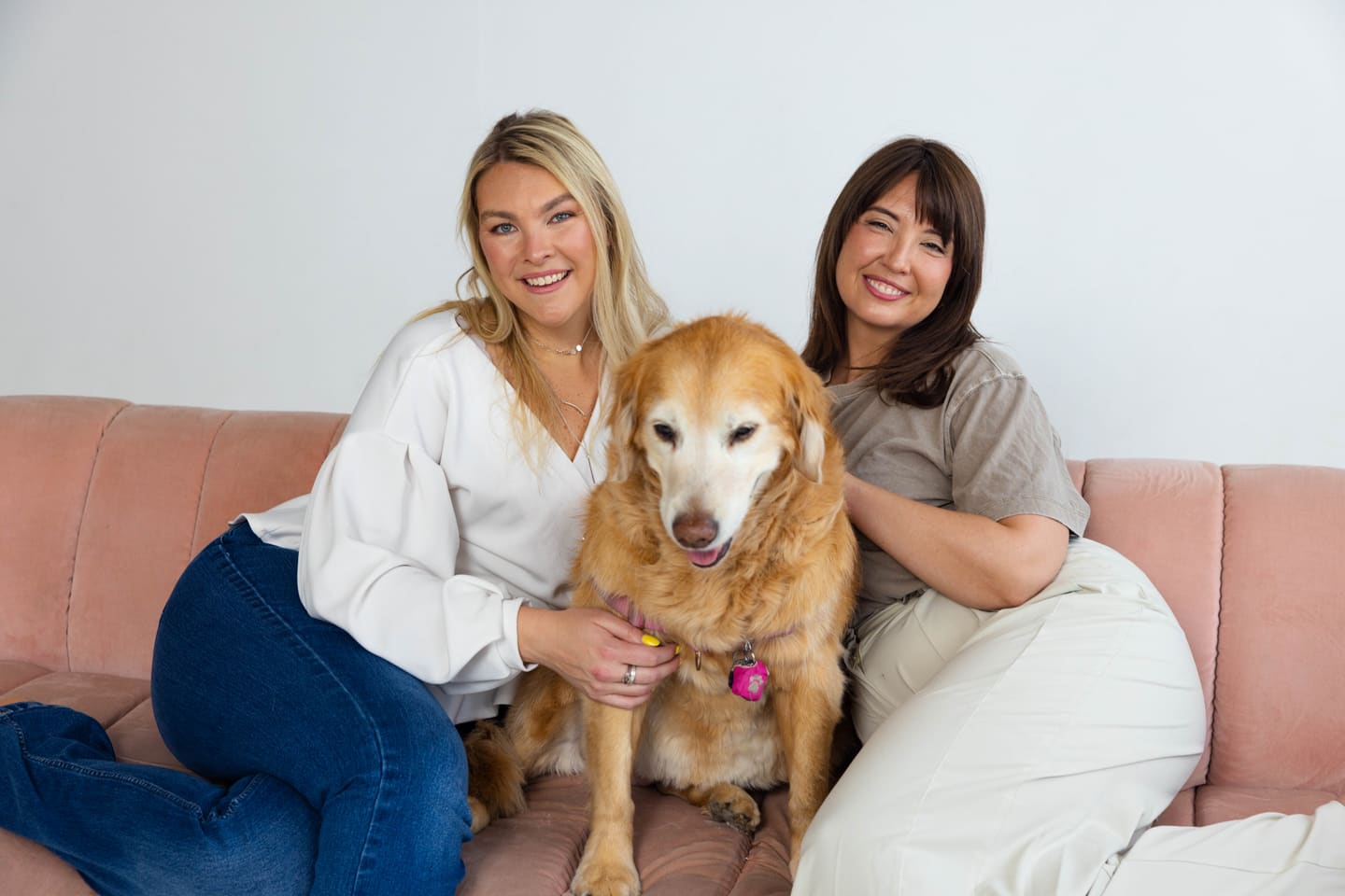 Hannah Snider and Tori Brown seated with Lola in a warm therapy office